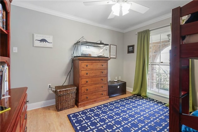 bedroom featuring ceiling fan, ornamental molding, and light hardwood / wood-style flooring