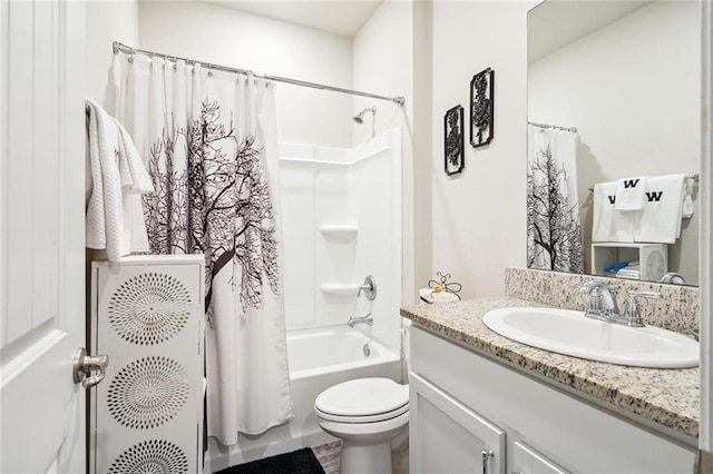 full bathroom featuring shower / bath combo, vanity, and toilet