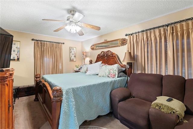 carpeted bedroom with ceiling fan and a textured ceiling