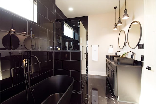 bathroom featuring vanity, plus walk in shower, and tile patterned flooring