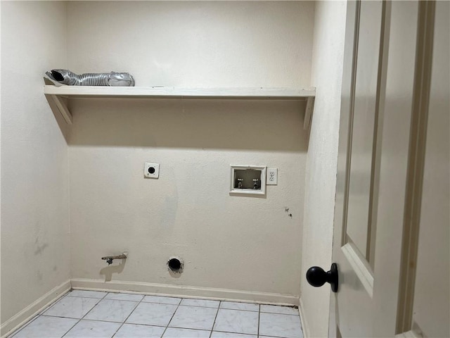 laundry area with hookup for a washing machine, hookup for a gas dryer, hookup for an electric dryer, and light tile patterned floors