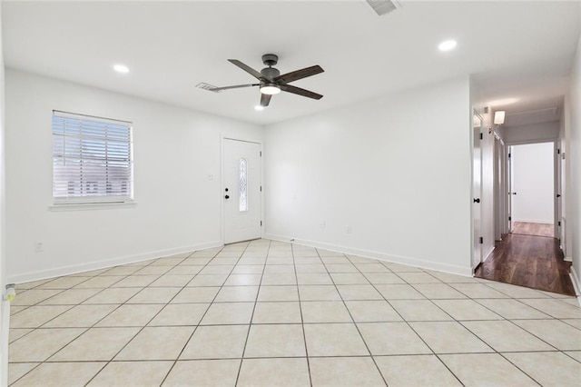 unfurnished room featuring baseboards, visible vents, recessed lighting, and a ceiling fan