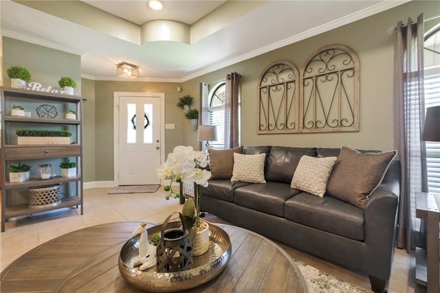 6900 Royal St, Arabi, LA 70032 - living room featuring light tile patterned flooring, baseboards, a tray ceiling, and ornamental molding