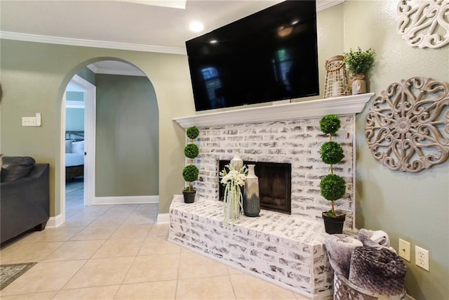 6900 Royal St, Arabi, LA 70032 - tiled living area with ornamental molding, arched walkways, baseboards, and a brick fireplace