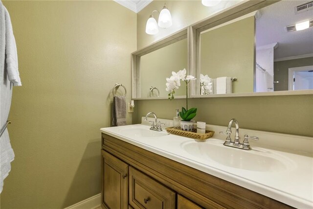 6900 Royal St, Arabi, LA 70032 - full bath featuring crown molding, double vanity, and baseboards