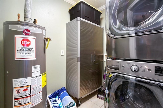 6900 Royal St, Arabi, LA 70032 - washroom featuring stacked washer / drying machine, water heater, and tile patterned floors