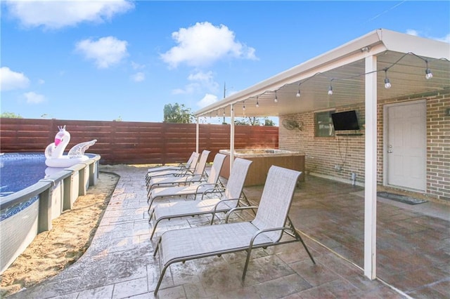 6900 Royal St, Arabi, LA 70032 - fenced backyard featuring a patio area, a jacuzzi, and an outdoor pool