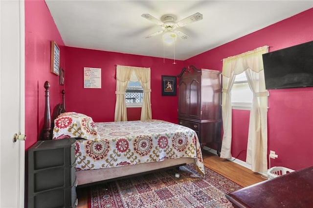 bedroom featuring wood-type flooring and ceiling fan