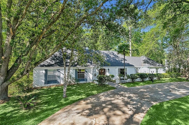 ranch-style house with a front lawn