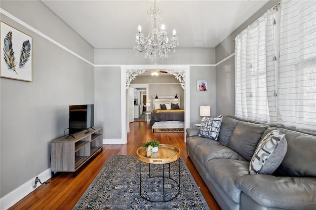 living room featuring hardwood / wood-style flooring and a chandelier