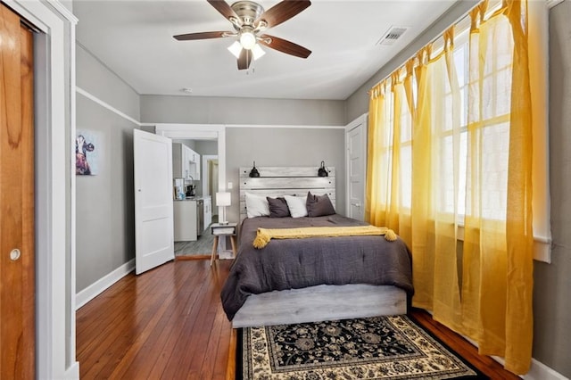 bedroom featuring dark hardwood / wood-style flooring and ceiling fan