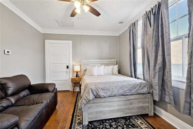 bedroom with ceiling fan, ornamental molding, and hardwood / wood-style floors