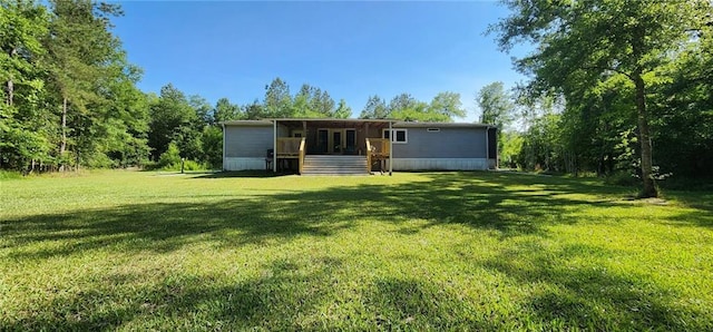 49266 Woodhaven Rd, Tickfaw, LA 70466 - back of house featuring a deck and a yard