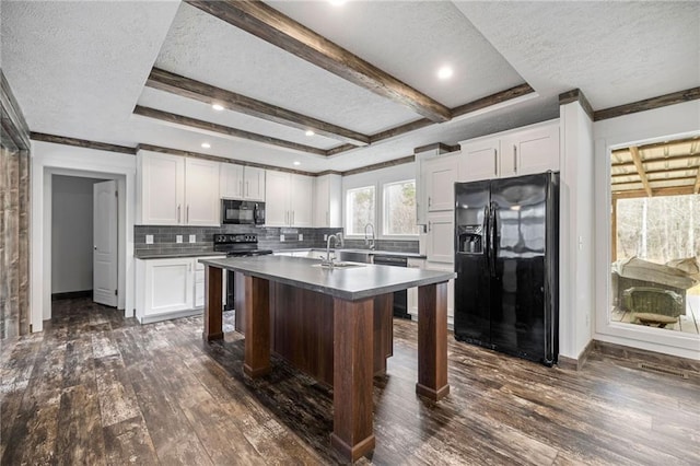 kitchen with dark wood-type flooring, black appliances, and white cabinets