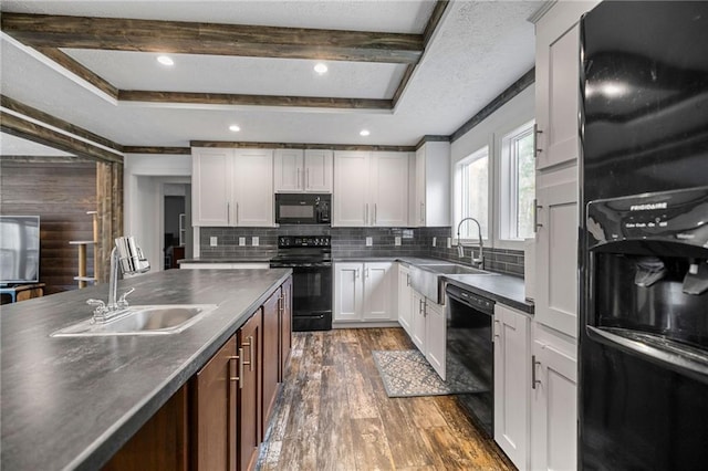 kitchen with white cabinetry, sink, black appliances, and dark hardwood / wood-style floors