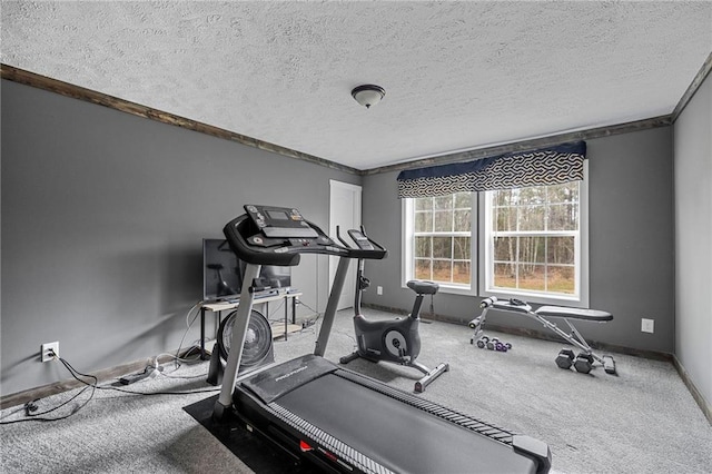 exercise area with carpet floors and a textured ceiling