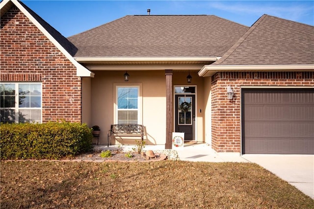 view of front of home with a garage, covered porch, and a front lawn