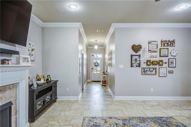 foyer entrance featuring ornamental molding