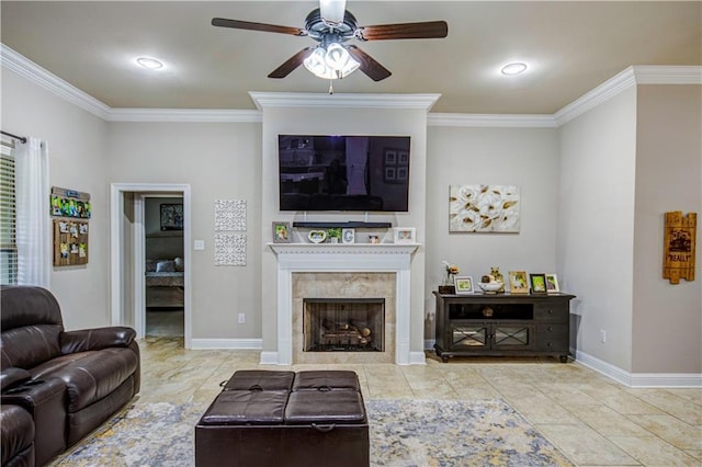 tiled living room featuring ornamental molding, a premium fireplace, and ceiling fan