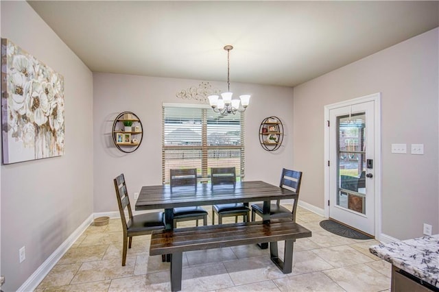 tiled dining space with an inviting chandelier