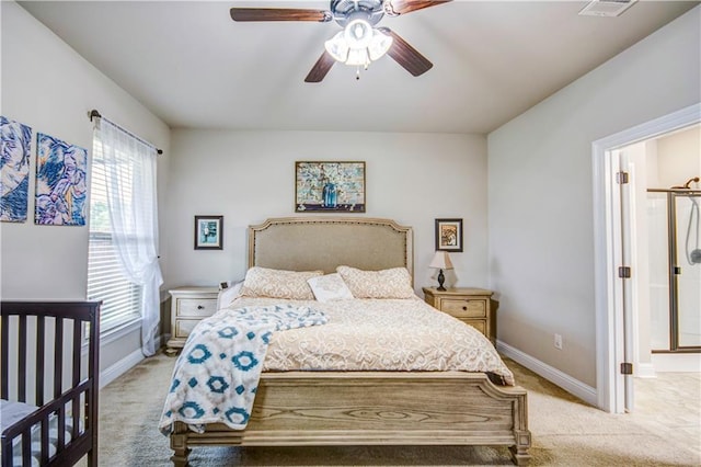 carpeted bedroom featuring connected bathroom and ceiling fan