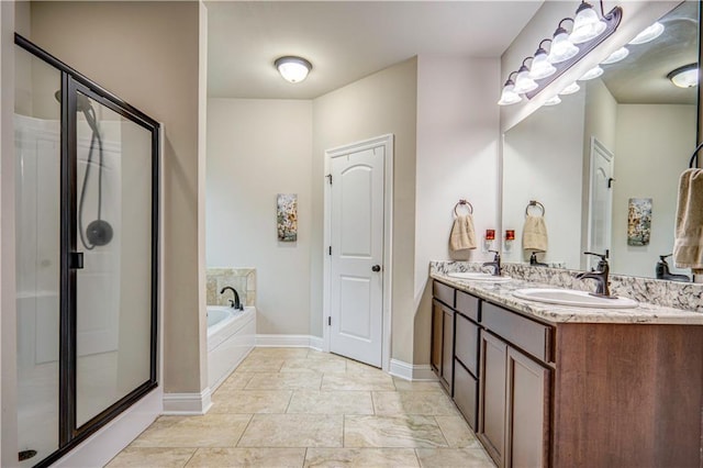 bathroom featuring tile patterned floors, vanity, and separate shower and tub