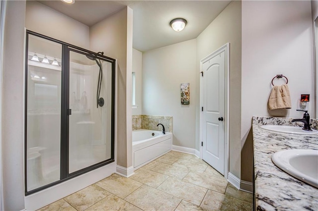 bathroom with tile patterned floors, vanity, and separate shower and tub