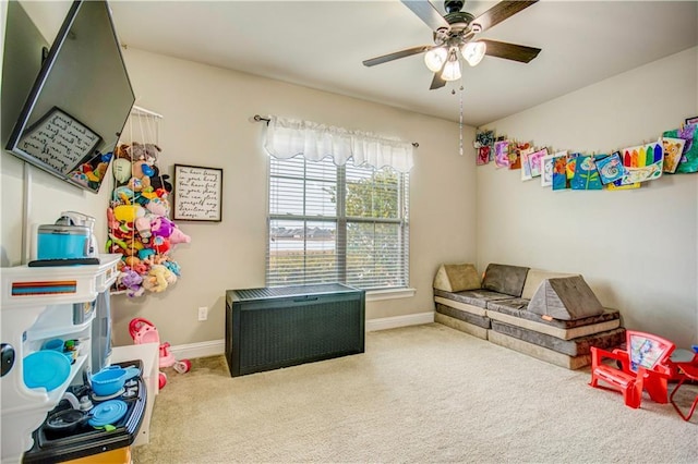 rec room featuring ceiling fan and carpet flooring