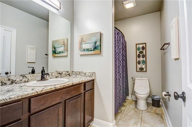 bathroom with vanity and toilet