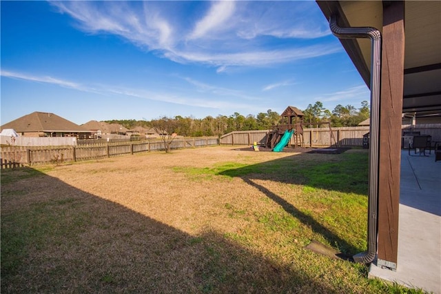 view of yard with a patio and a playground