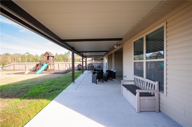 view of patio featuring a playground and an outdoor living space