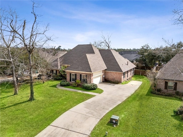 view of front of property featuring a garage and a front yard