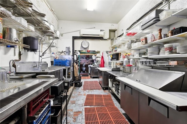 kitchen featuring sink and a wall unit AC