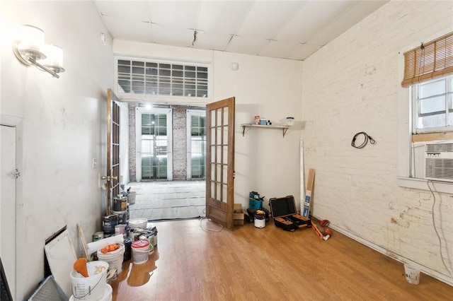 misc room with hardwood / wood-style floors and french doors