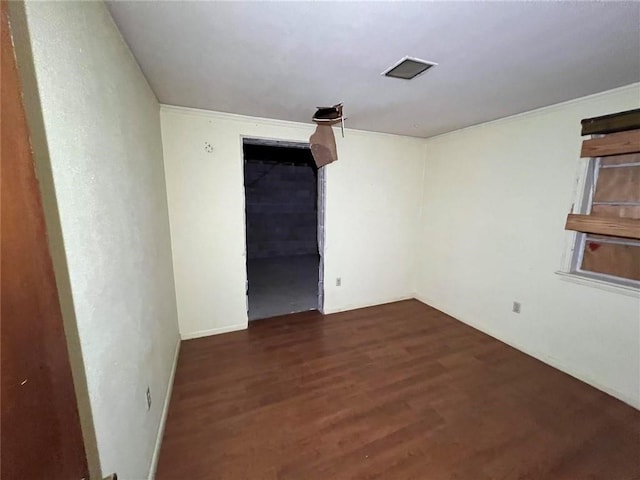 unfurnished room with dark hardwood / wood-style flooring