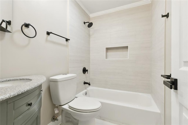 full bathroom with vanity, tiled shower / bath, crown molding, and toilet