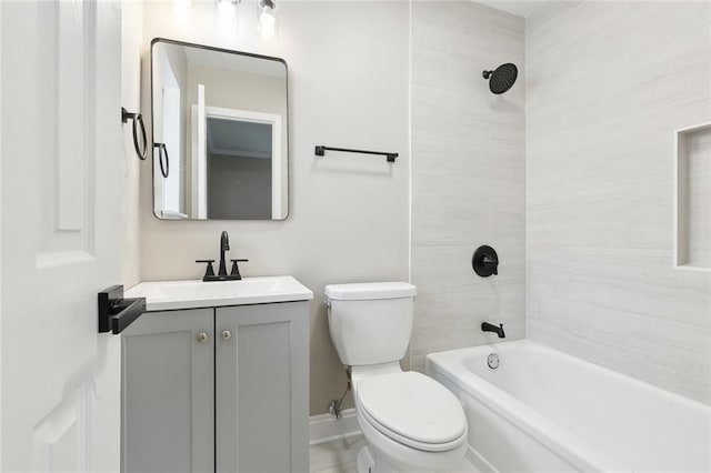 full bathroom with tiled shower / bath combo, vanity, and toilet