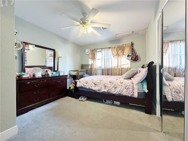 carpeted bedroom with ceiling fan