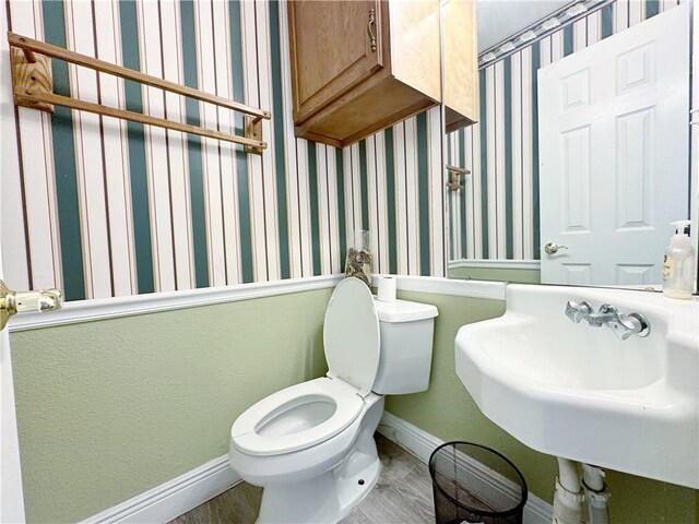 bathroom with toilet and sink