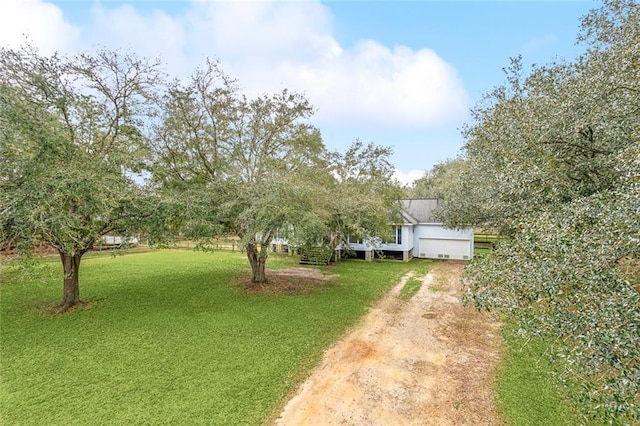 185 Maverick Run, Pearl River, LA 70452 - view of yard with an attached garage and driveway