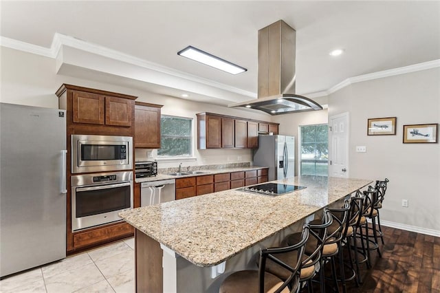 185 Maverick Run, Pearl River, LA 70452 - kitchen featuring a kitchen island, a kitchen bar, ornamental molding, island range hood, and stainless steel appliances