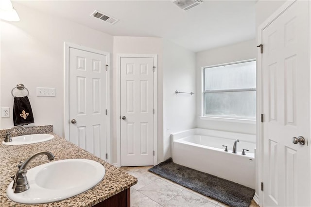 185 Maverick Run, Pearl River, LA 70452 - full bathroom featuring a sink, visible vents, a garden tub, and double vanity