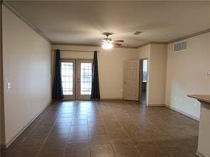 empty room featuring ornamental molding, french doors, and ceiling fan