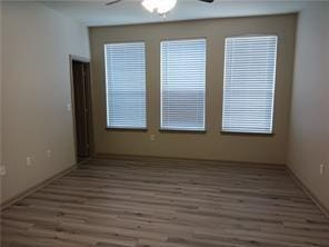 spare room featuring dark hardwood / wood-style floors and ceiling fan