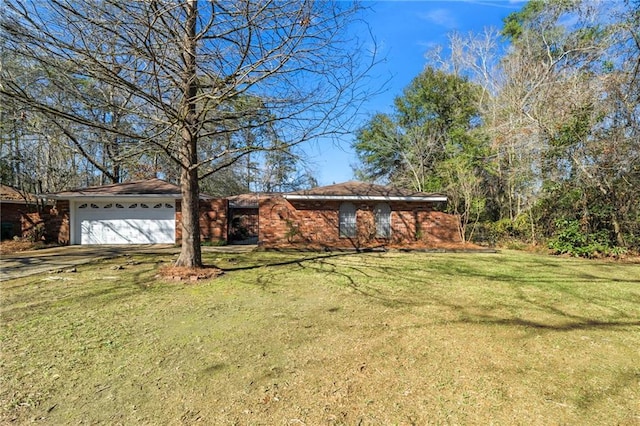 view of front of house featuring a garage and a front lawn