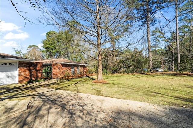 view of yard featuring a garage