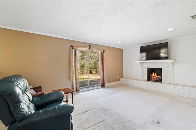 living room with carpet floors, crown molding, a fireplace, and a textured ceiling