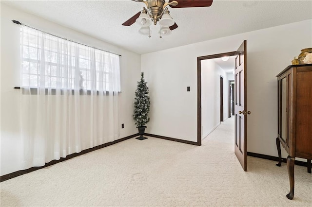 122 Belle Terre Blvd, Covington, LA 70433 - unfurnished room with light carpet, ceiling fan, baseboards, and a textured ceiling
