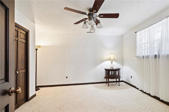 122 Belle Terre Blvd, Covington, LA 70433 - carpeted empty room with a textured ceiling, a ceiling fan, and baseboards
