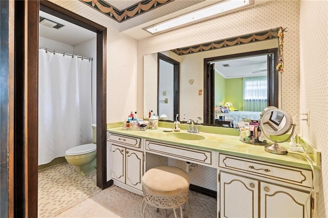 122 Belle Terre Blvd, Covington, LA 70433 - full bath with wallpapered walls, vanity, and toilet